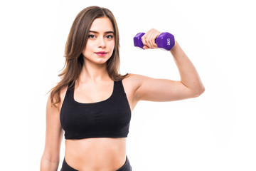 Athletic woman doing exercise for arms. Portrait of muscular fitness model working out with dumbbells on grey background. Strength and motivation