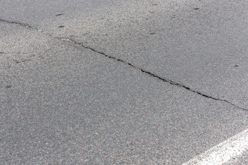 Cracks on the asphalt road.