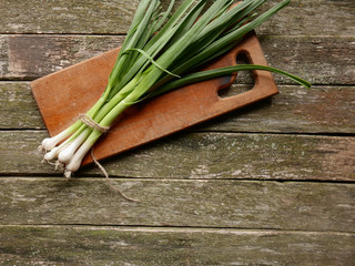 fresh onion on a wooden table copyspace