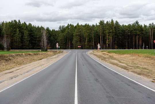 T-junction. Asphalt crossroad. 