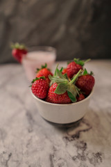 Fresh strawberries and milkshake. Cold beverage and red fruits