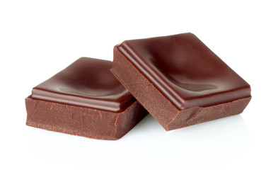 Dark chocolate pieces isolated on white background