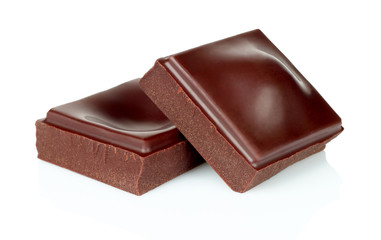 Dark chocolate pieces isolated on white background