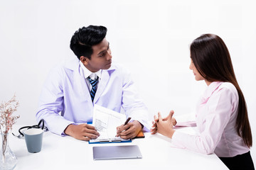 The doctor listening and observe the symptoms of patient woman,for treatment plan
