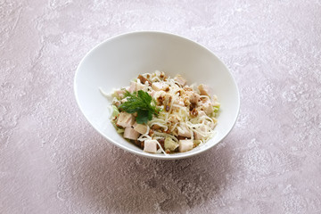 Salad with chicken meat, walnuts, cheese and chinese cabbage