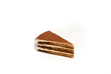 Slice of honey cake isolated on white background, no shadow