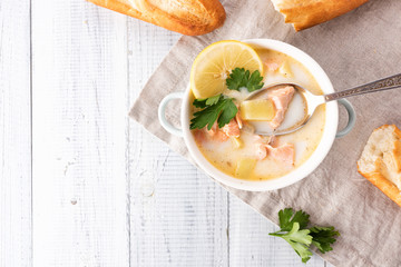 Finnish creamy soup with salmon, potatoes, onions, and carrots