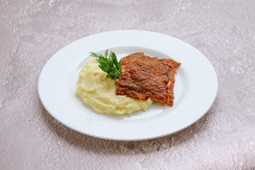 Fried hake fillet with spinach, cheese and rice
