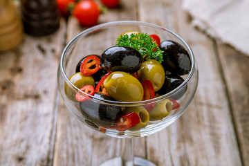 Kalamata olives on wooden table