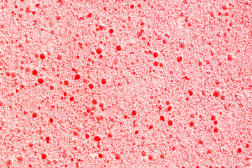 Red porous sponge foam structure. Plastic air bubble holes texture. - obrazy, fototapety, plakaty