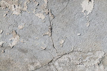 Close-up on a plastered wall. Old, cracked wall surface.