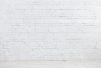 White brick wall and white wooden floor