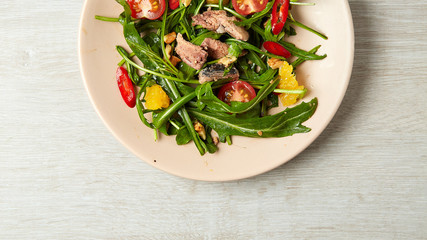 Salad with peppers and tomatoes on a plate