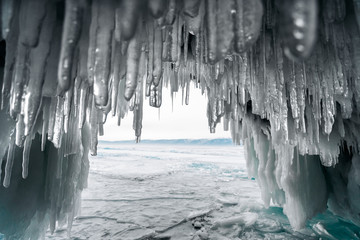 Huge icicles of ice hang in an ice cave