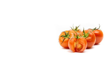 Tomato closeup on white background. Selective focus and crop fragment