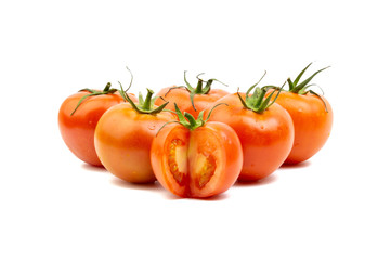 Tomato closeup on white background. Selective focus and crop fragment