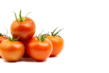Tomato closeup on white background. Selective focus and crop fragment