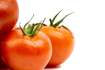 Tomato closeup on white background. Selective focus and crop fragment