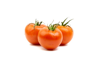 Tomato closeup on white background. Selective focus and crop fragment