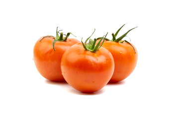 Tomato closeup on white background. Selective focus and crop fragment
