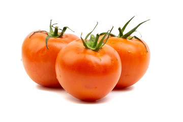 Tomato closeup on white background. Selective focus and crop fragment