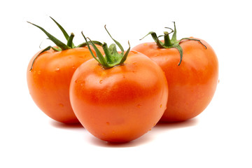 Tomato closeup on white background. Selective focus and crop fragment