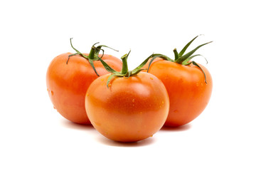 Tomato closeup on white background. Selective focus and crop fragment