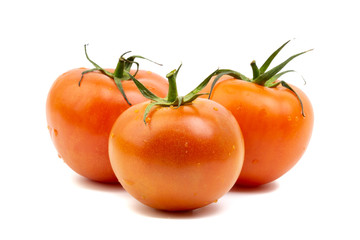 Tomato closeup on white background. Selective focus and crop fragment