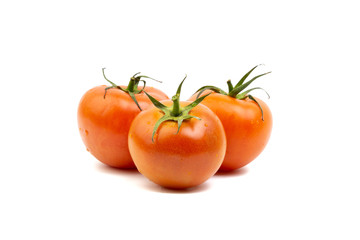 Tomato closeup on white background. Selective focus and crop fragment
