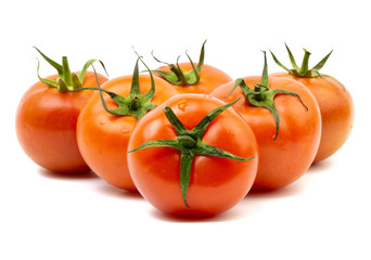 Tomato closeup on white background. Selective focus and crop fragment