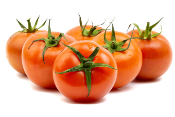 Tomato closeup on white background. Selective focus and crop fragment