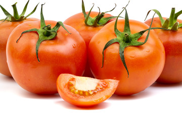 Tomato closeup on white background. Selective focus and crop fragment