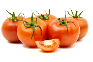 Tomato closeup on white background. Selective focus and crop fragment