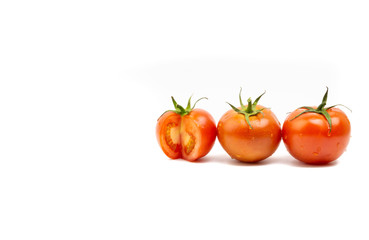 Tomato closeup on white background. Selective focus and crop fragment