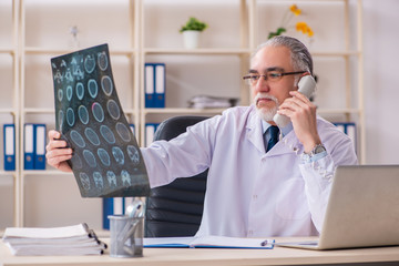 Fototapeta premium Aged male doctor radiologist in the clinic