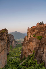 Fototapeta na wymiar Great Meteoron Monastery. Beautiful scenic view, ancient traditional greek building on the top of huge stone pillar in Meteora, Eastern Orthodox Church, Pindos, Thessaly, Greece, Europe. 