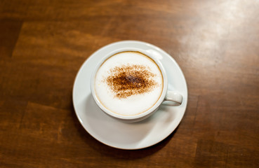 cup of coffee on wooden table