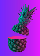 A neon pineapple. Rich inner world, wide soul can hide in grey cover. A fruit cut in two peaces is bright pink inside on gradient background. Human nature. Modern design. Contemporary art collage.