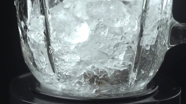Ice is ground in a blender, macro and side view