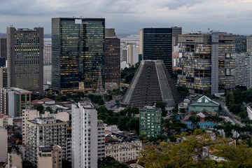 Saint Sebastian cathedral in the city centre with modern office buildings surrounding it and in the foreground residential and cultural neighbourhood of Lapa
