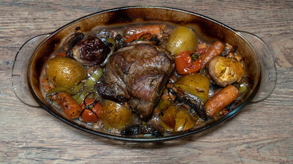 Homemade roasted beef topside with cherry tomatoes,oregano,garlic,carrot and onion