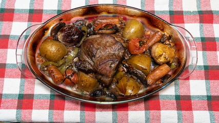 Homemade roasted beef topside with cherry tomatoes,oregano,garlic,carrot and onion