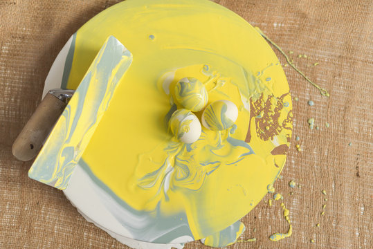 easter eggs with paint yellow and gray