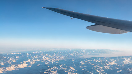 Wonderful View Of Tian Shan Snow Mountains Through Window An Airplane