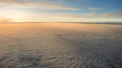 Obraz premium Aerial traveling. Flying at dusk or dawn. Fly through orange cloud and sun.