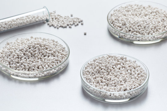 A closeup of a white plastic resin in granules