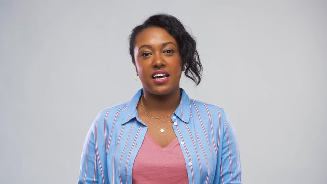 blogging, hiring and employment concept - happy african american woman having video call or interview over grey background