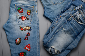 Jeans decorated with various patches