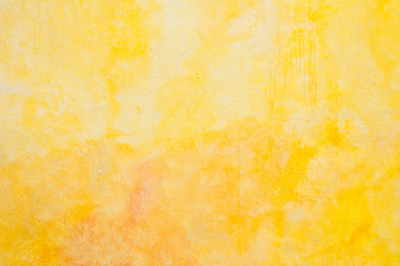 Fototapeta premium closeup of yellow painting on the wall texture