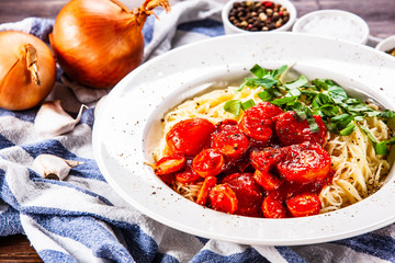 Pasta with tomato sauce and sausage